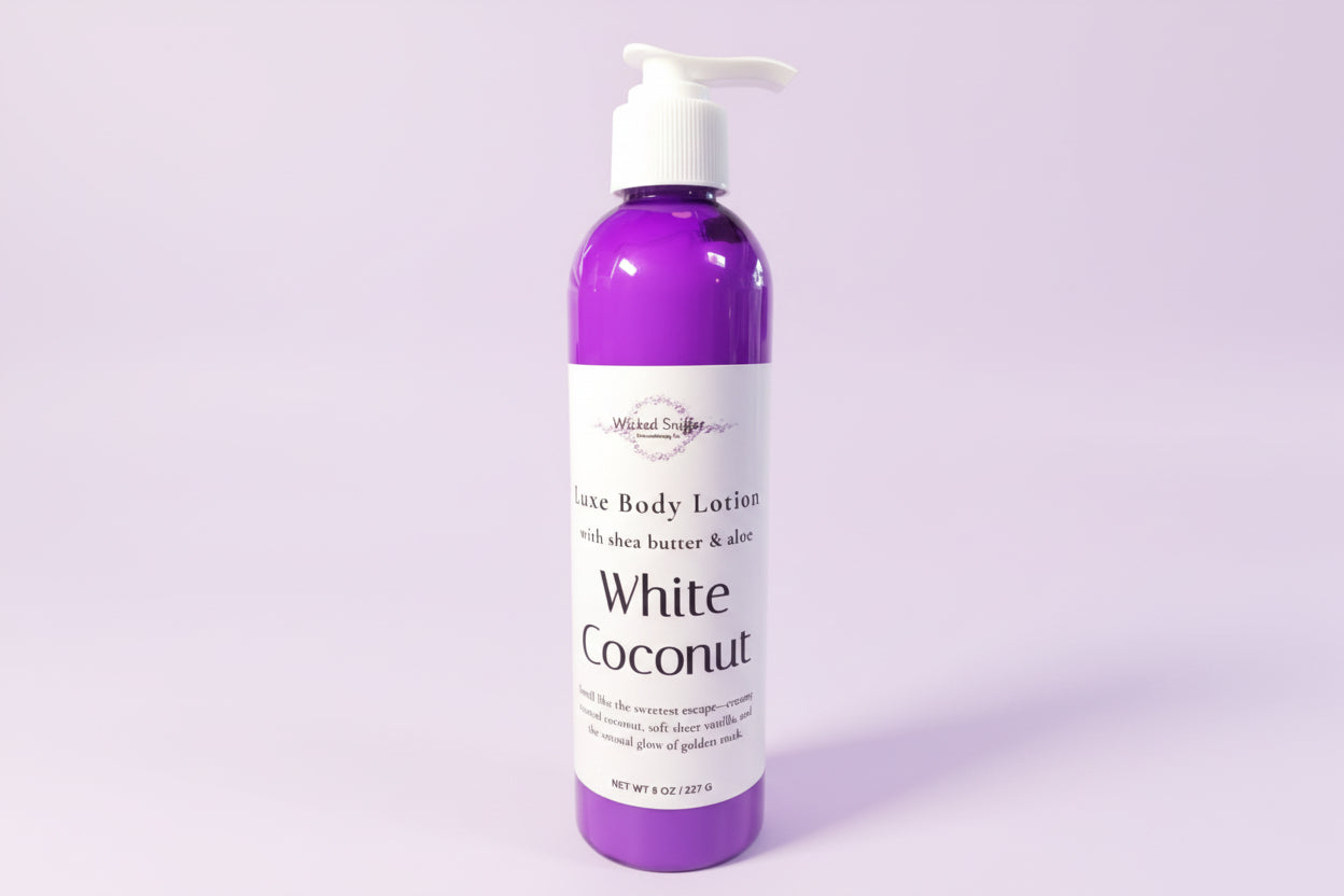 Bottle of White Coconut body lotion on a purple background