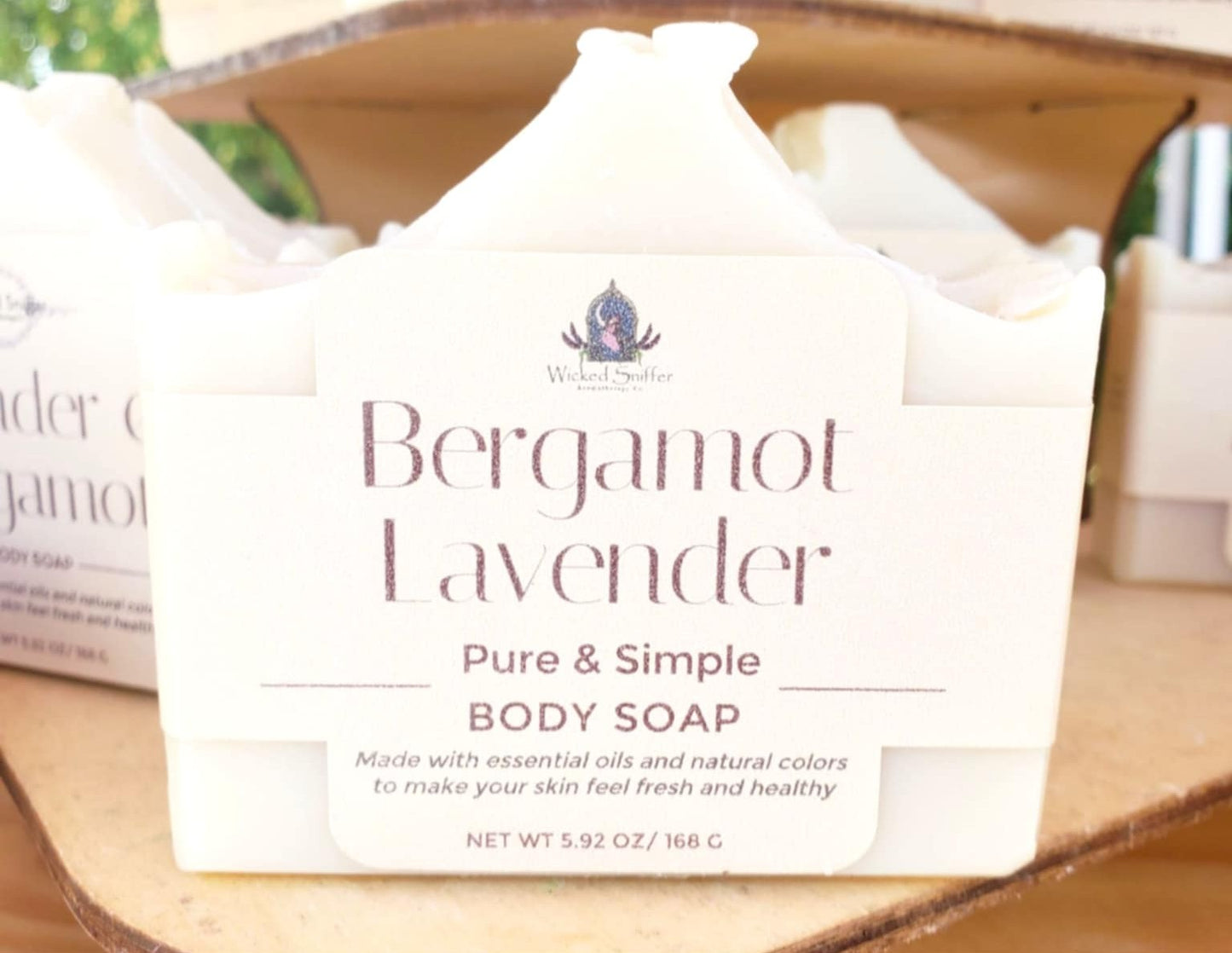 Bergamot Lavender body soap packaging on a wooden surface