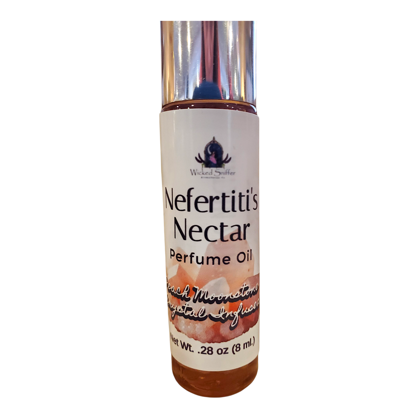 Perfume oil bottle labeled 'Nefertiti's Nectar' on a white background