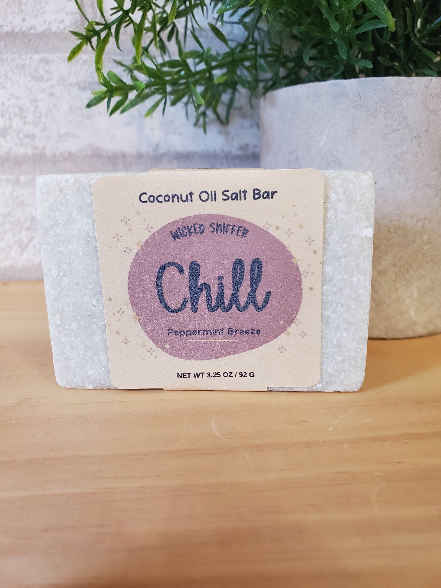 Coconut oil salt bar with 'Chill' label on a wooden surface