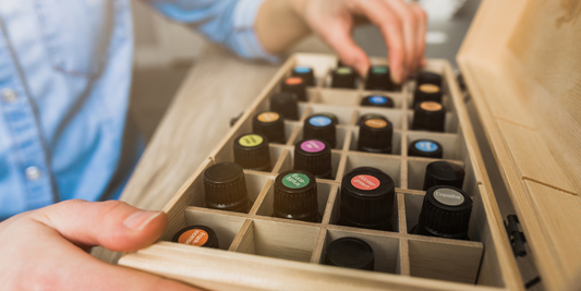 Picture of a box of essential oils with colorful lids.