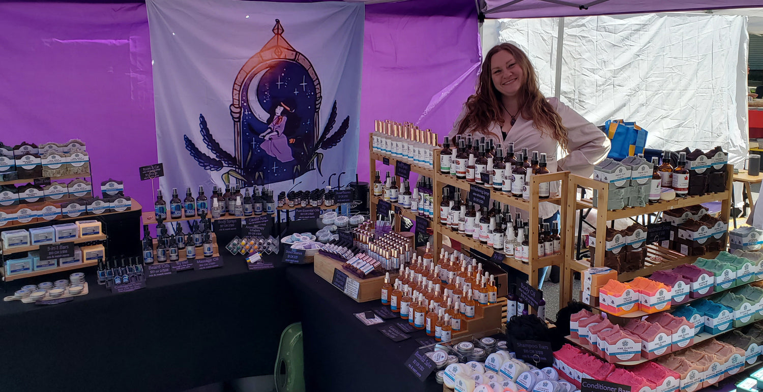 Lindsay behind her table at a festival