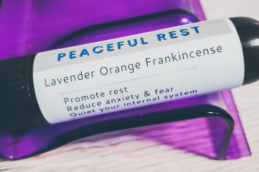White label with blue words peaceful rest and black words that say lavender orange frankincense promote rest reduce anxiety and fear quiet your internal system