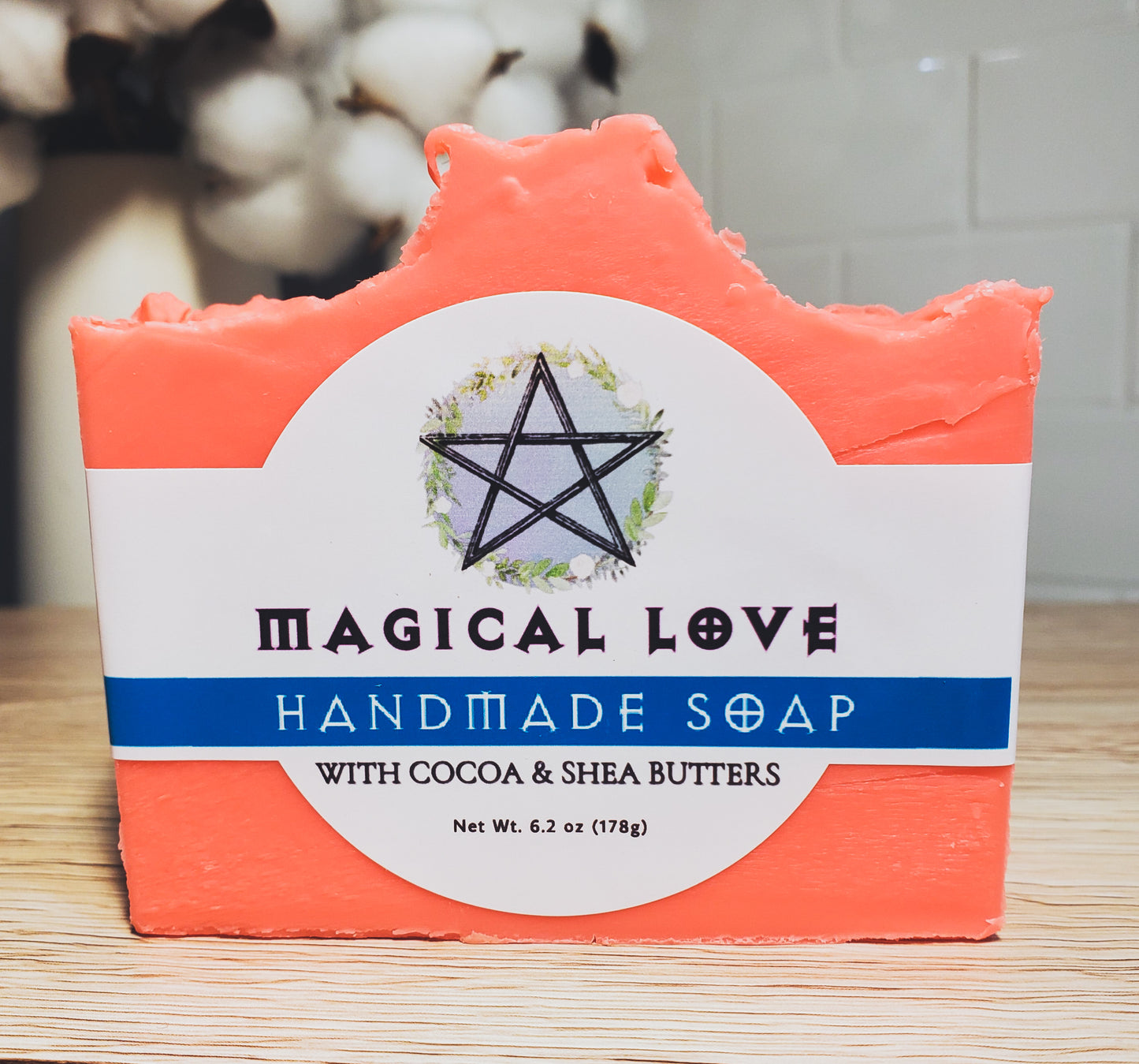 Photo of bar soap with White band label and blue bar across