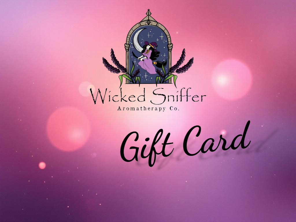 Wicked Sniffer Aromatherapy Co. gift card design with a mystical design on a pink and purple gradient background.