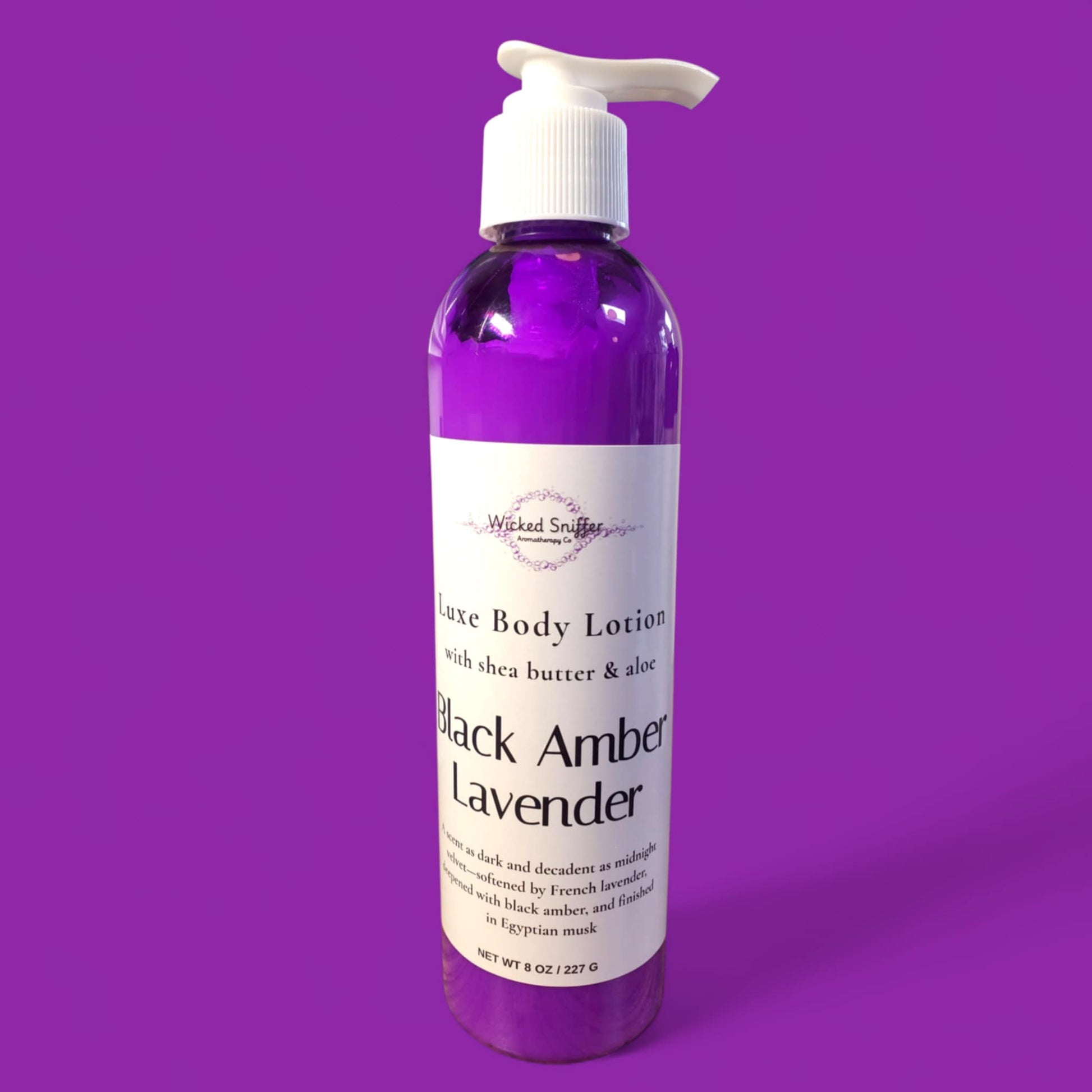 Bottle of Black Amber Lavender body lotion on a purple background