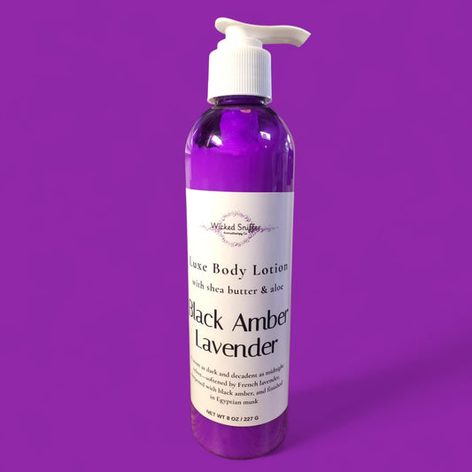 Bottle of Black Amber Lavender body lotion on a purple background