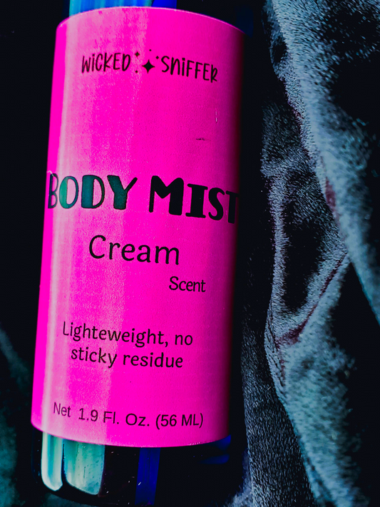 Pink bottle of 'Wicked Sniffer' body mist with text on a dark background