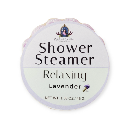 Lavender shower steamer with packaging on a white background
