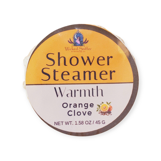 Wicked Sniffer Shower Steamer packaging with 'Orange Clove' scent on a white background