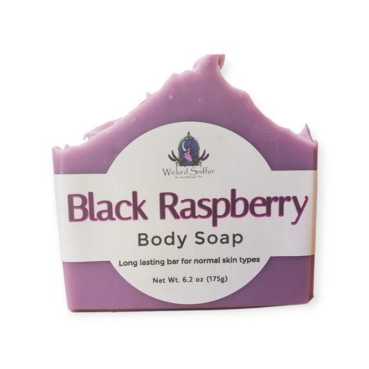 Purple bar of soap with a label on a white background