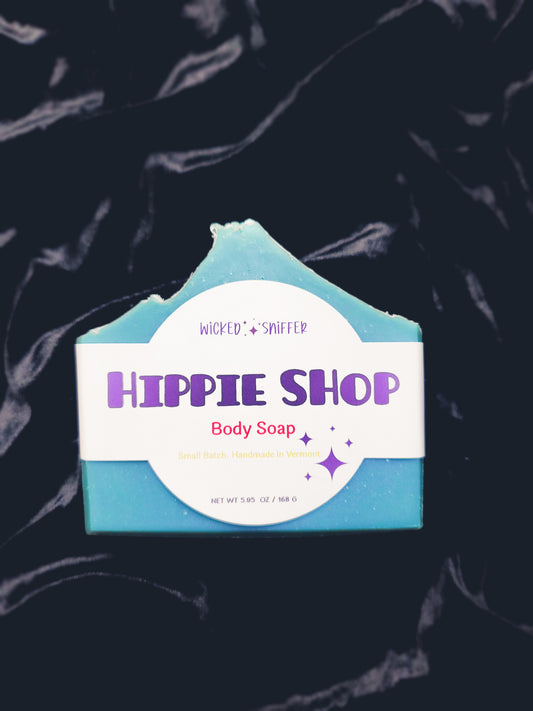 Body soap bar with 'Hippie Shop' branding on a dark background