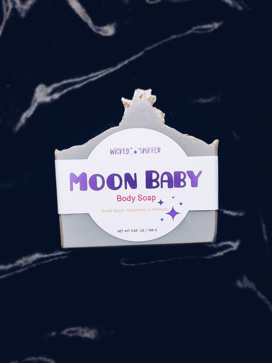 Moon Baby body soap with a label on a dark background