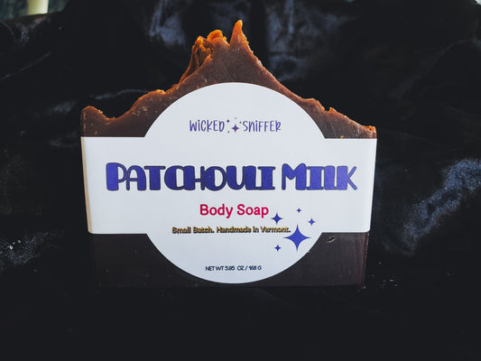 Bar of handmade Patchouli Milk cold process soap  on a dark background made in Vermont 