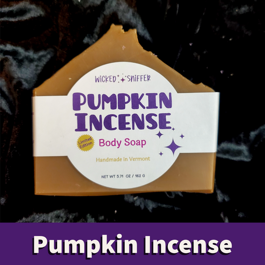 A house-shaped bar of Pumpkin Incense Body Soap with a white label featuring purple text, set against a dark textured background with a purple banner at the bottom reading 'Pumpkin Incense'.