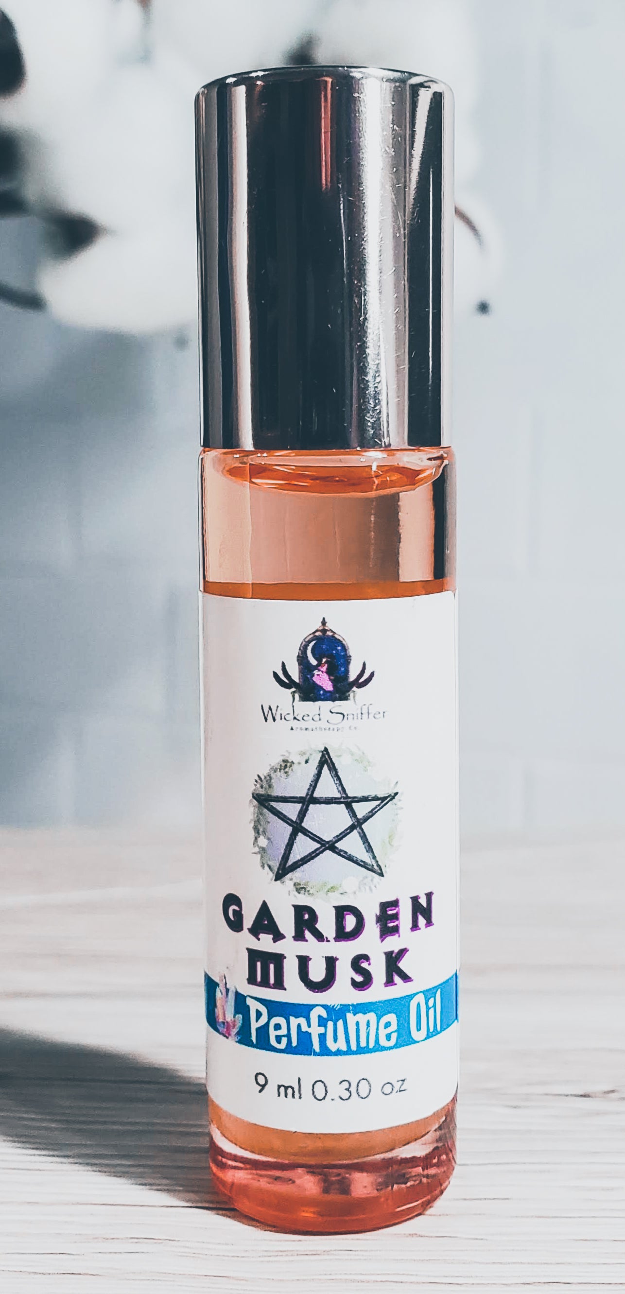 Rose gold bottle with white label