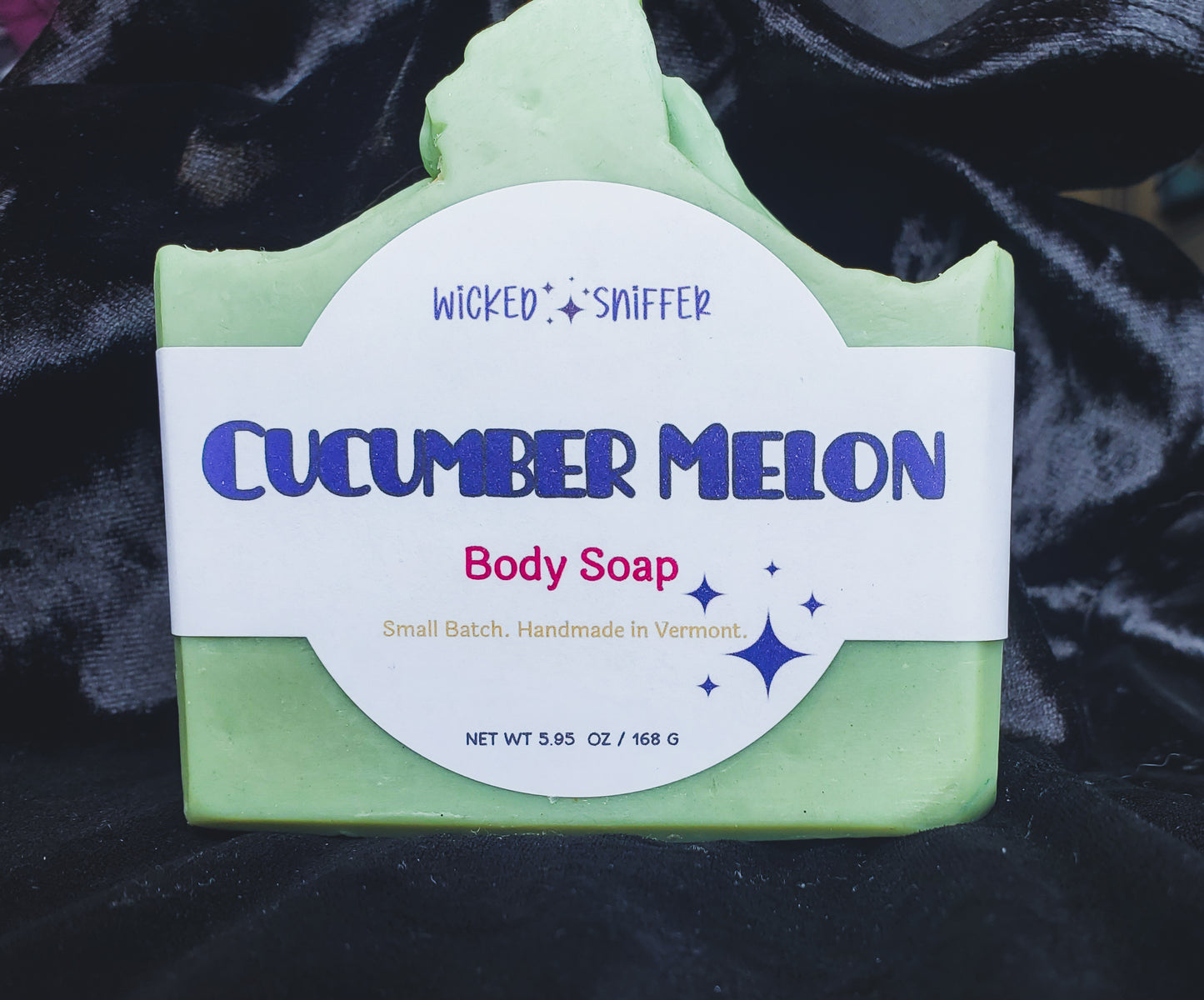 Green body soap bar with 'Wicked Sniffer' label on a dark background