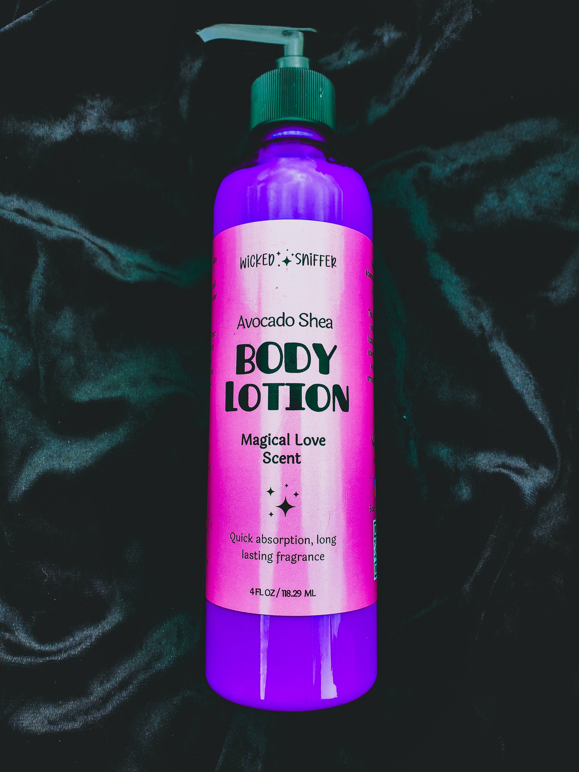 Purple body lotion bottle with pink label on a dark textured background