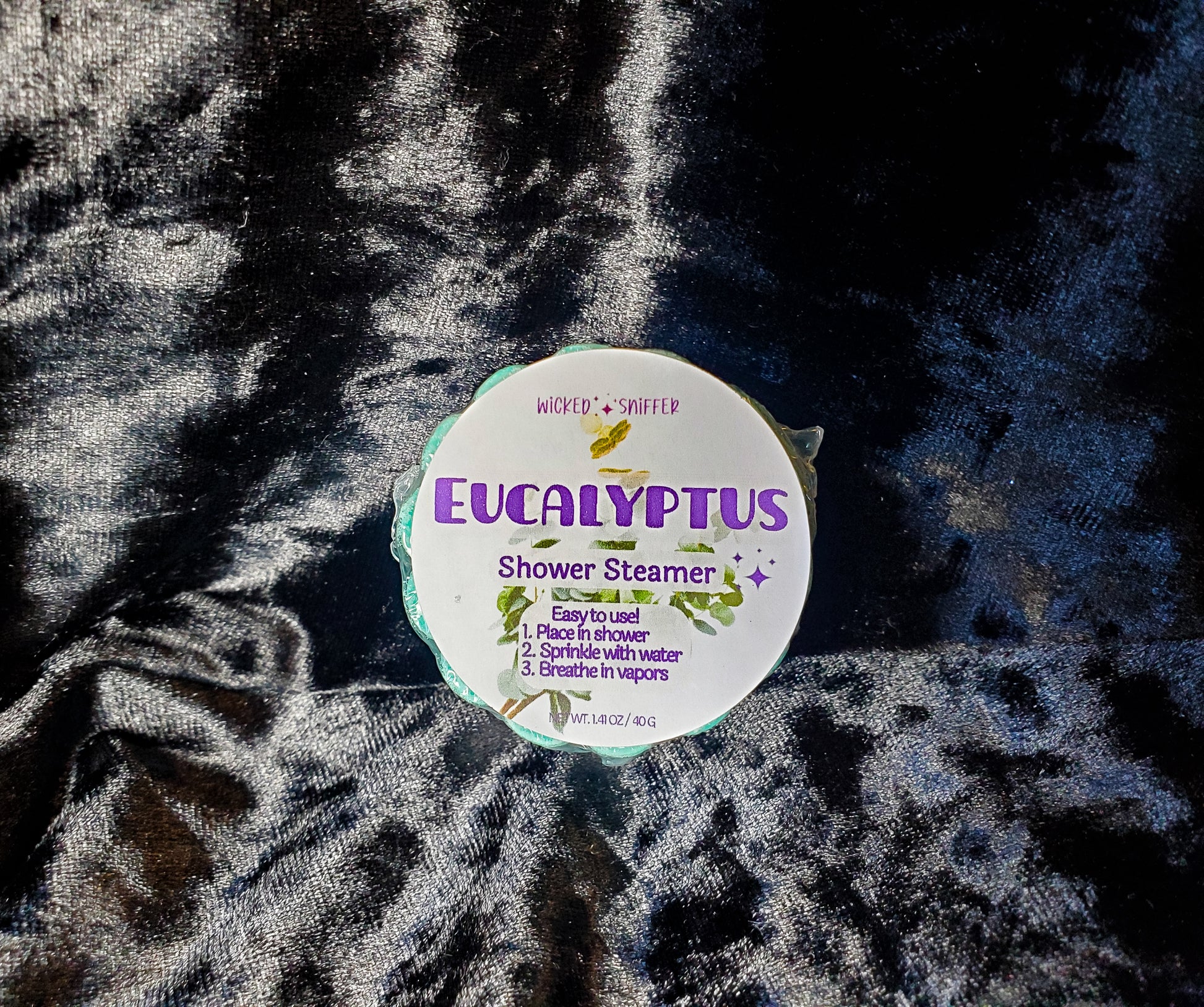 Eucalyptus shower steamer on a textured fabric background