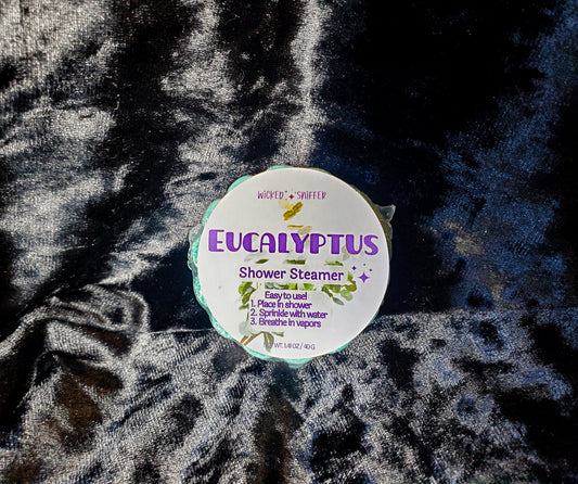 Eucalyptus shower steamer on a textured fabric background