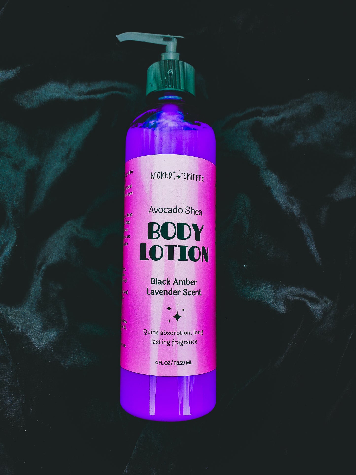 Purple body lotion bottle with black pump on a dark textured background