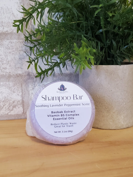 Shampoo bar  with a plant on a wooden surface