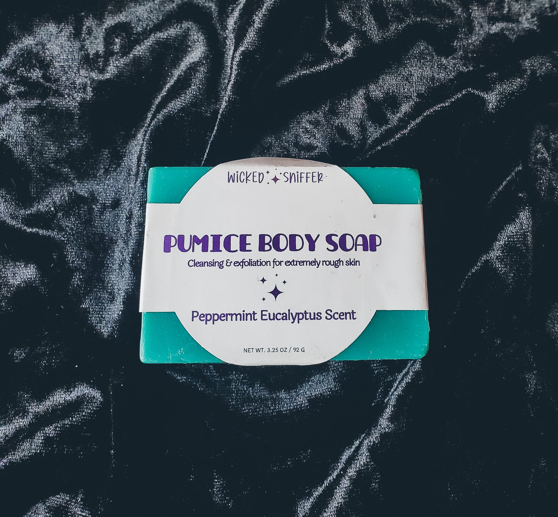 Blue soap with a white label on a black background