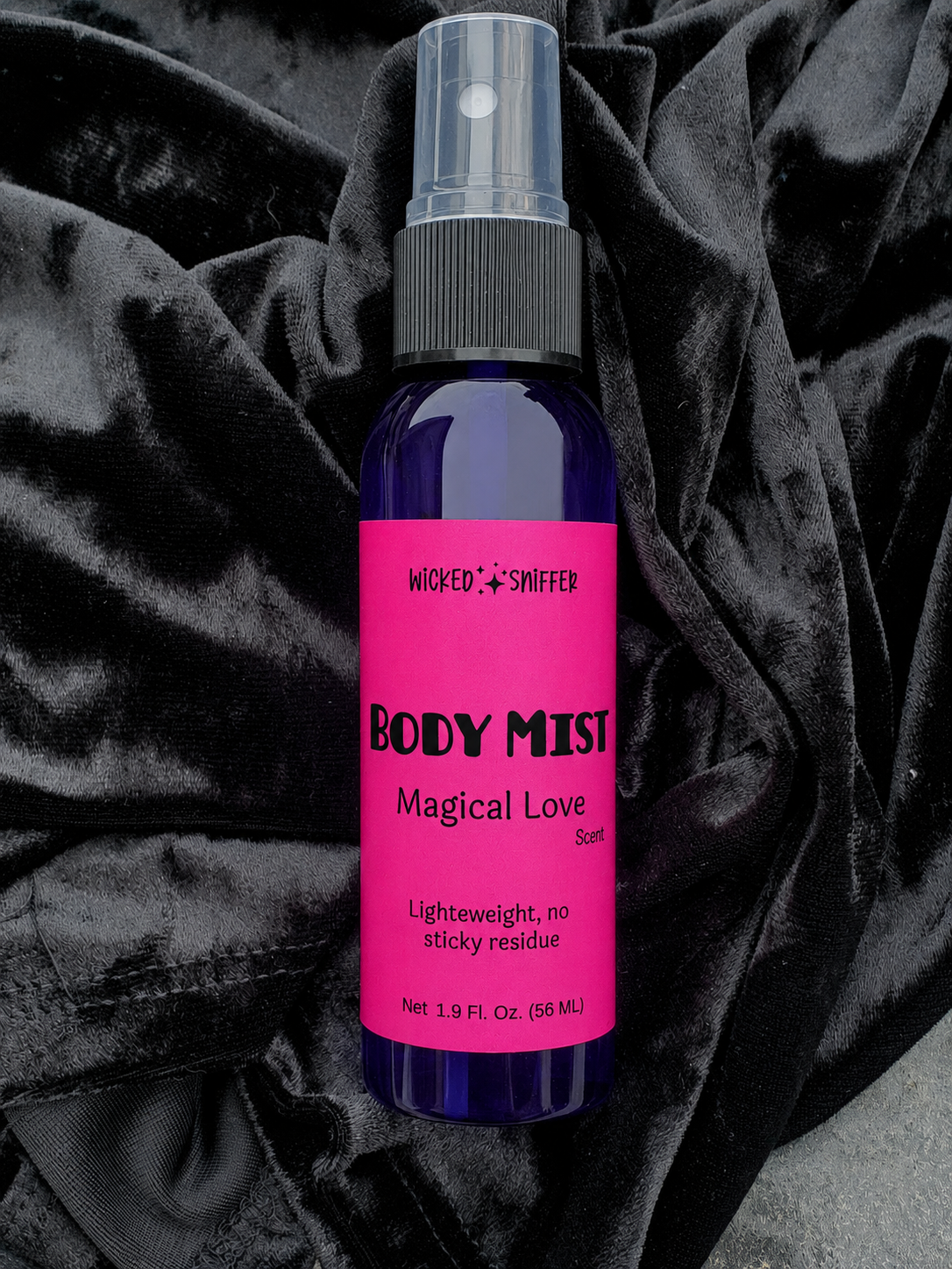 A blue bottle with a pink label on a black background 