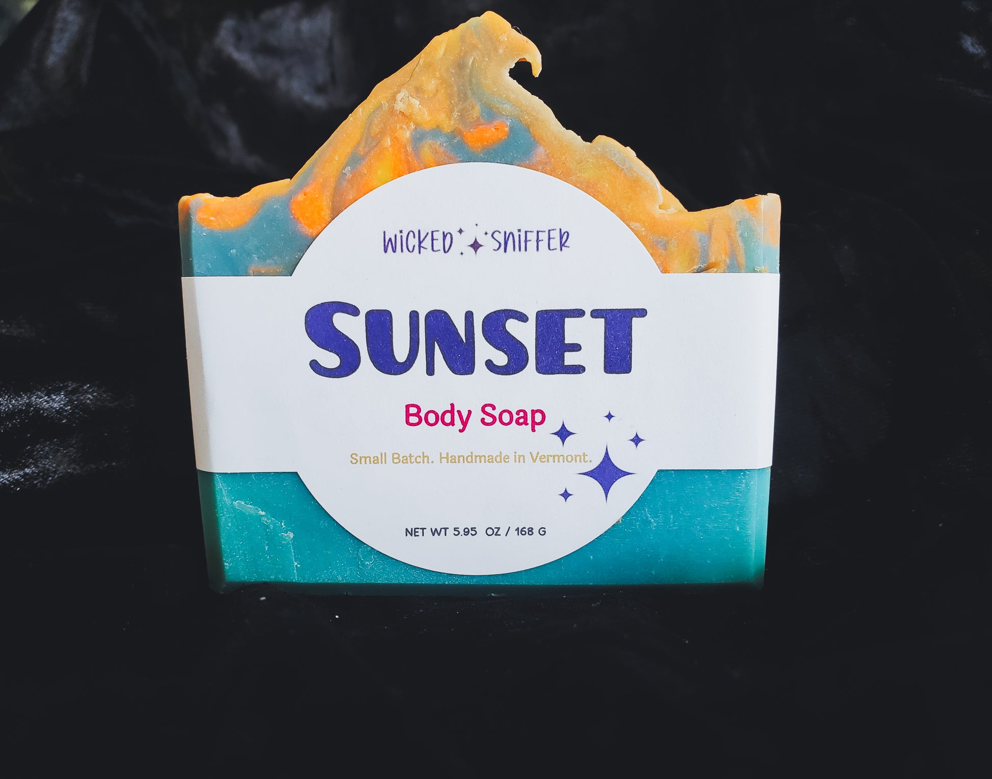 Bar of handmade, cold process, soap bar, with 'Sunset' label on a black background, made in Vermont 