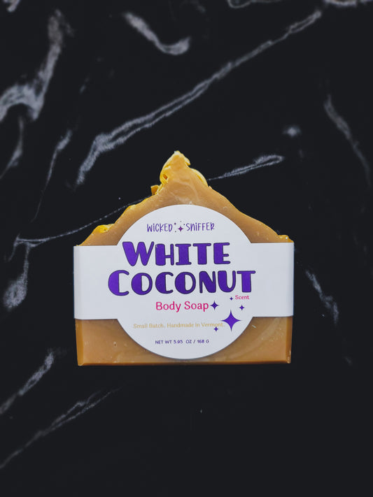 Bar of soap with a 'White Coconut' label on a dark background
